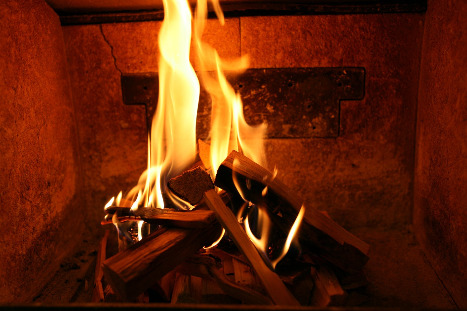 Close-up of a cozy, warm fire burning with kiln-dried logs from Mortimers Fuels.