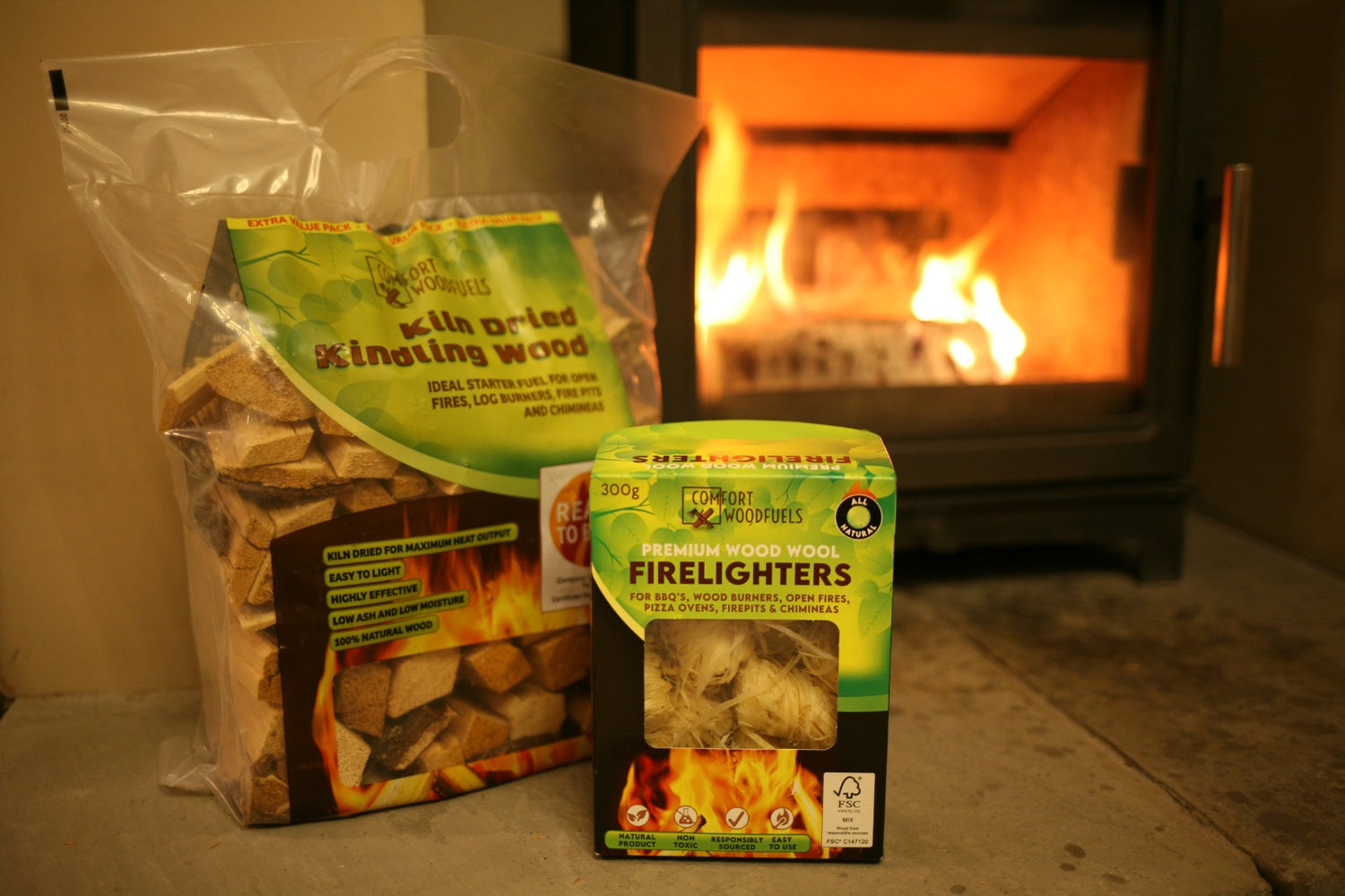 Mortimers Fuels kindling bag and wool firestarters in front of a cozy fire, perfect for easy fire starting.